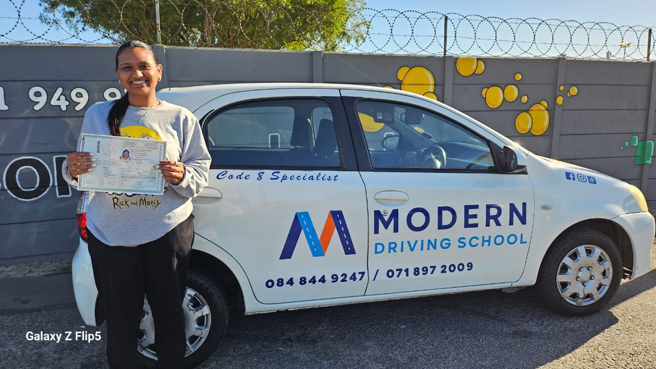 Learner smiling with fresh driver's licence